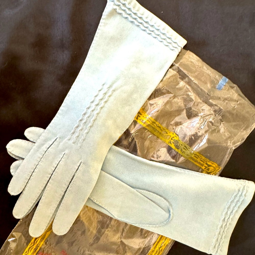 Tiny, vintage baby blue women’s gloves.